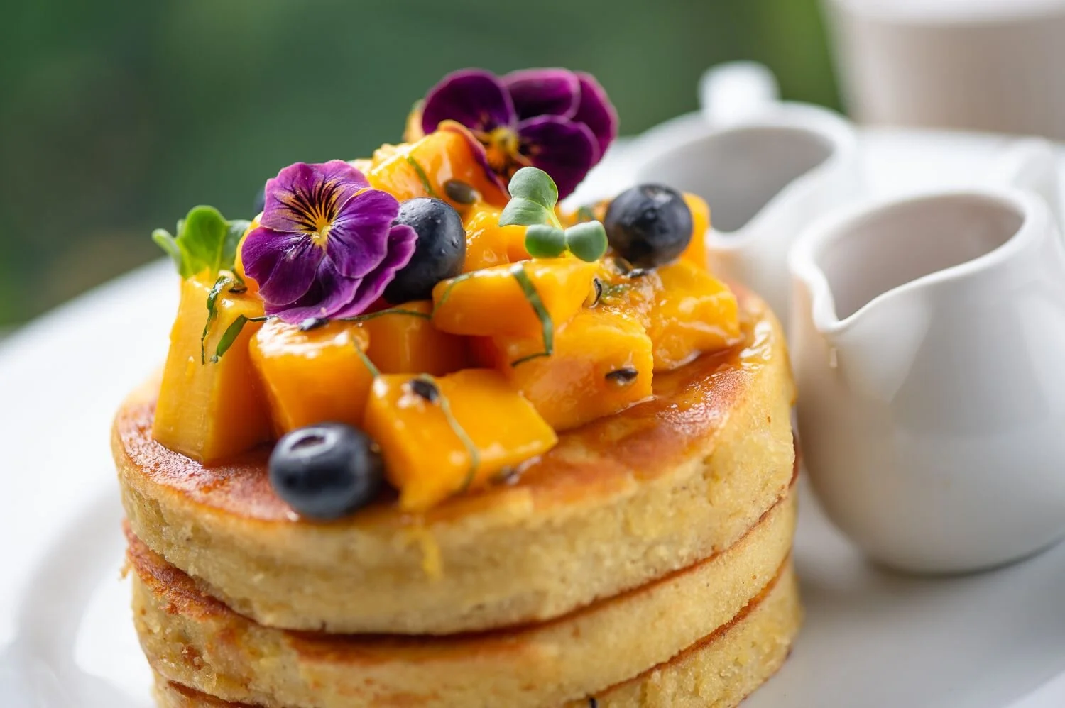 TAHITIAN: Coconut pancakes with coconut yoghurt, fresh mango
